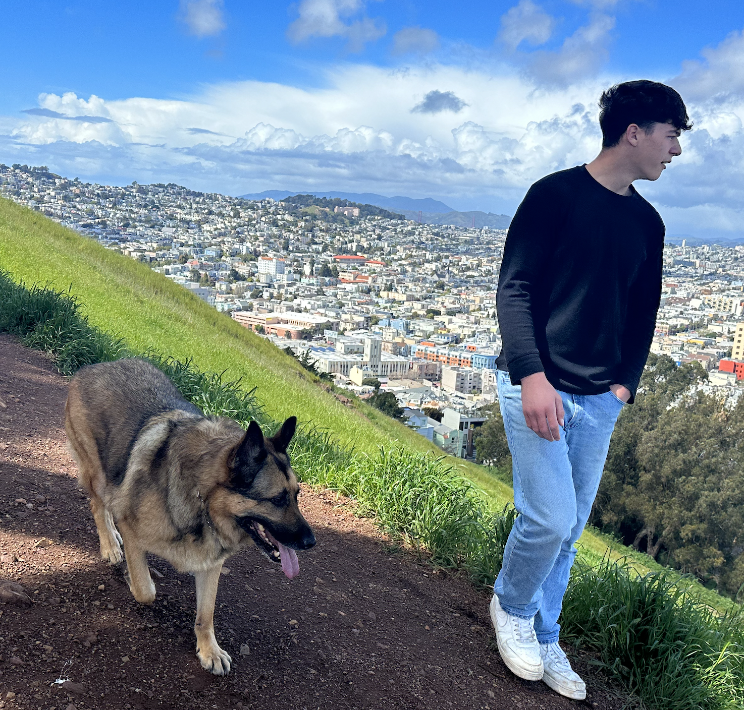 Man sitting with his German Shepherd emotional support dog